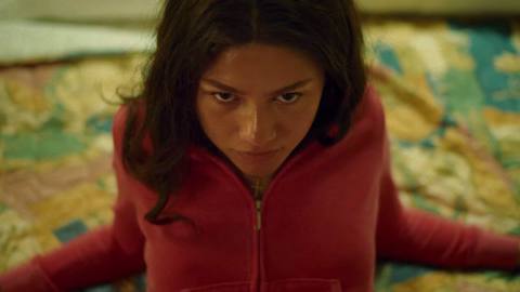 Teenage tennis champion Tashi (Zendaya) leans back on a hotel bed and stares lustily up at the camera in Challengers