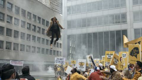 Starlight (Erin Moriarty) hovering above the crowd of Starlighters