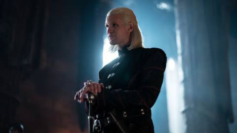 Matt Smith as Prince Daemon Targaryen standing with his hands folded atop a cane in House of the Dragon