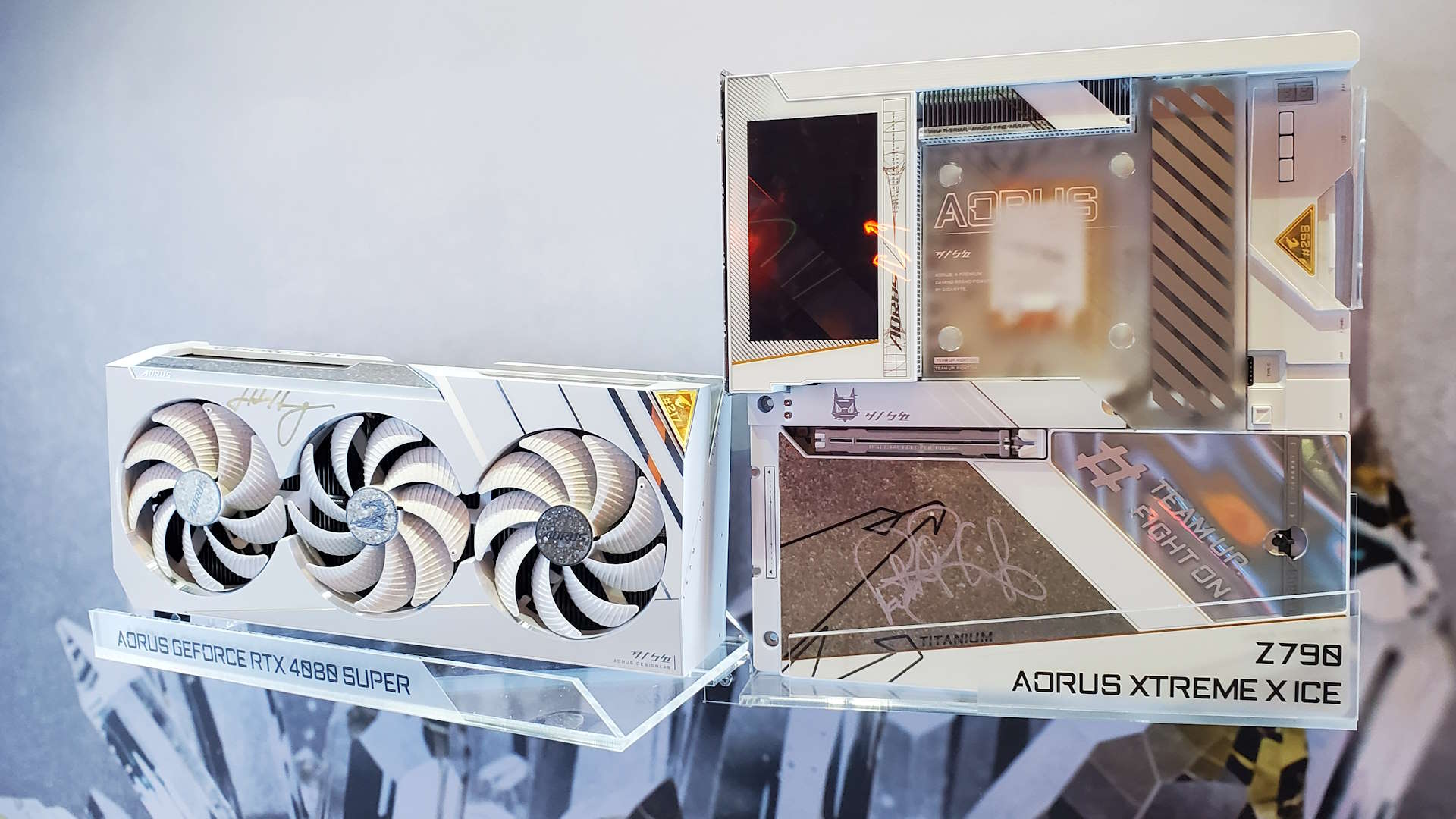 A photo of Intel's Pat Gelsinger and Nvidia's Jen-Hsun Huang signatures on a Gigabyte motherboard and graphics card, on display at Computex 2024