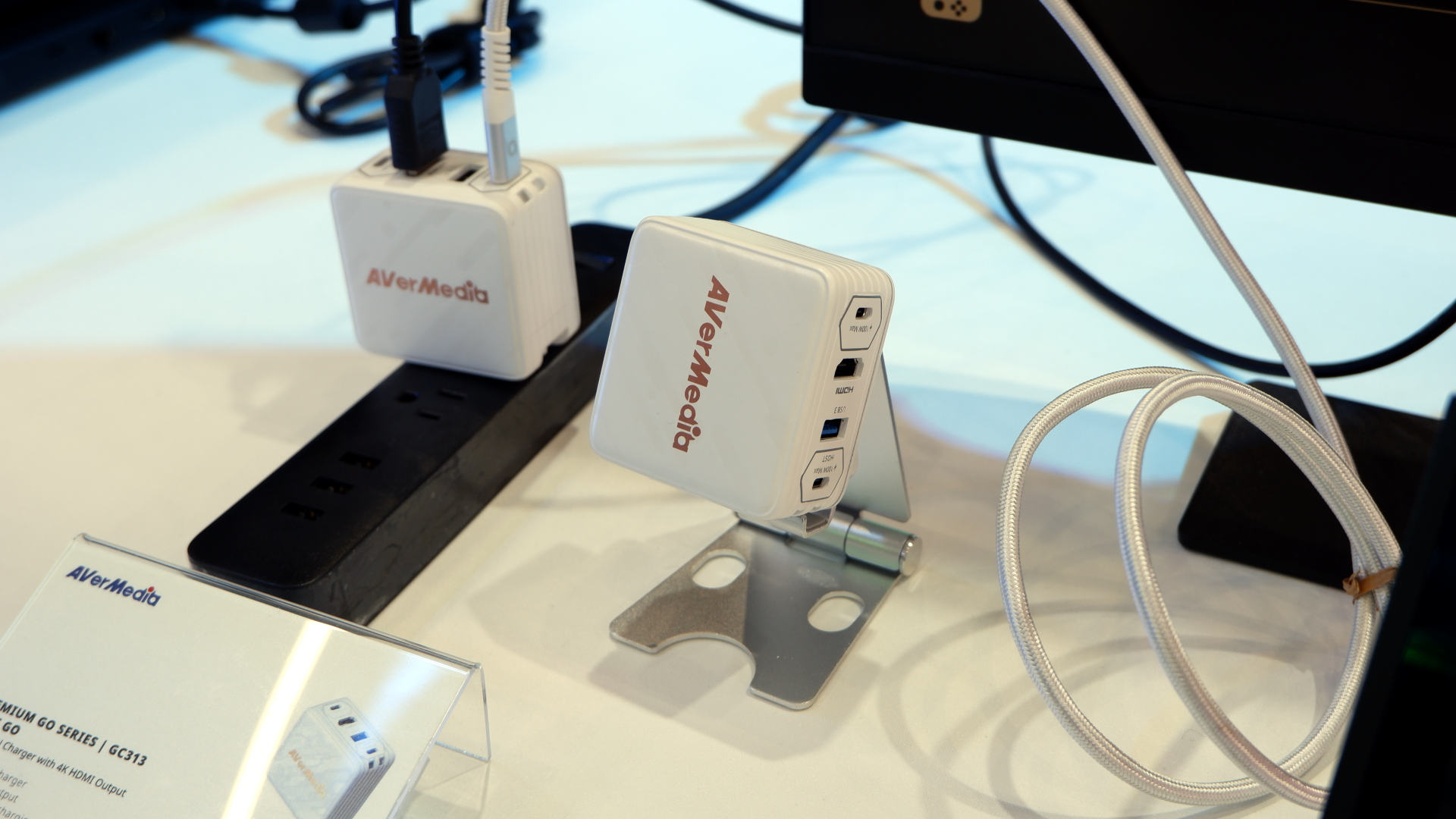 Photo of the Avermedia Premium Go series of GaN chargers, with HDMI 4K output, USB hub, and 1080p capture in the Elite Go