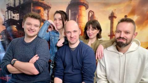 Left to right, Greg Jones, Louise Sugden, Chris Peach, Jamila Hall, and Daniel Saye in a press photo for Heretic Hunt, a new D&amp;D actual play set in the world of Warhammer 40,000.