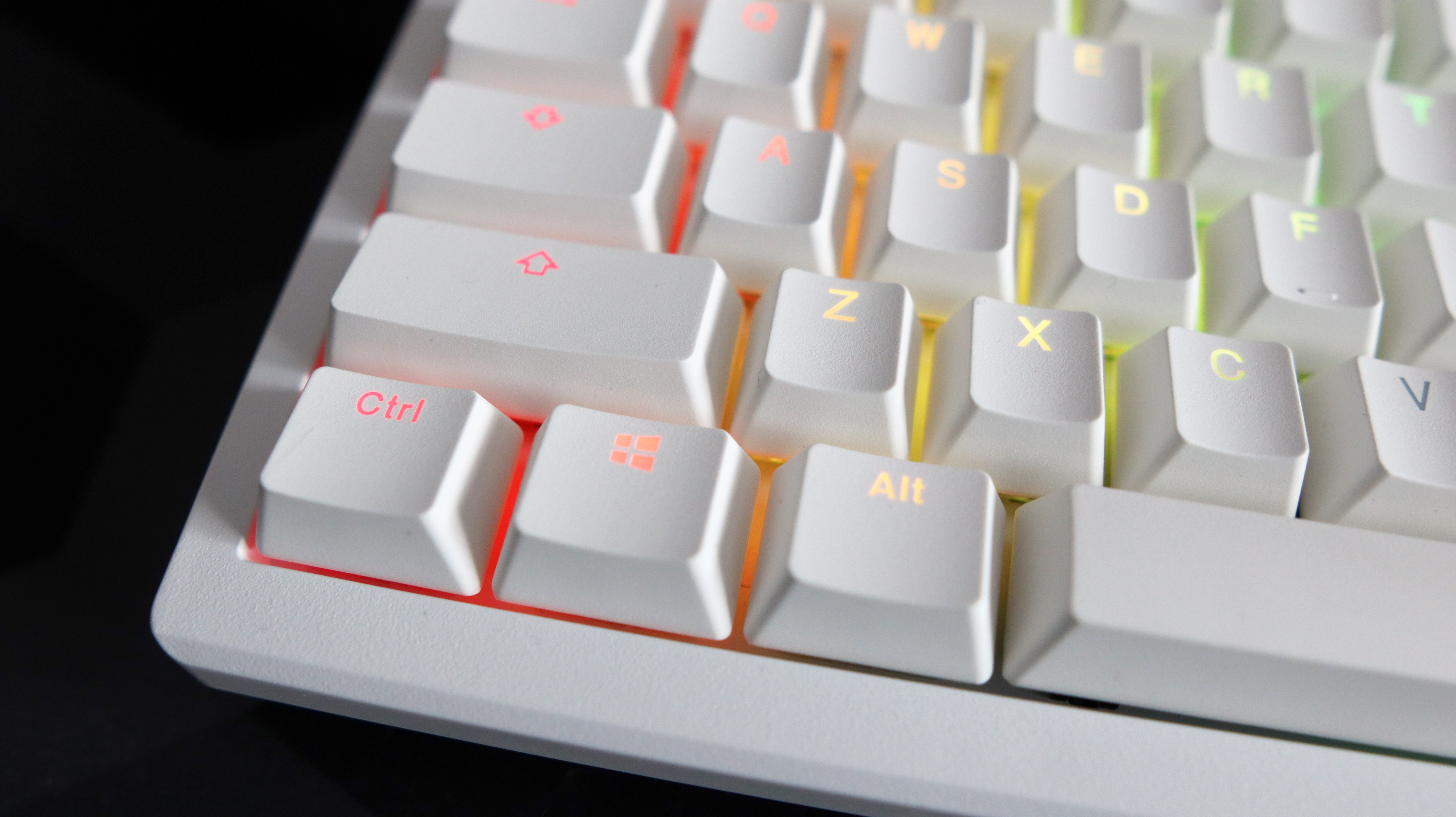 Ducky Zero 6108 gaming keyboard in white on a desk.