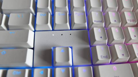 Ducky Zero 6108 gaming keyboard in white on a desk.