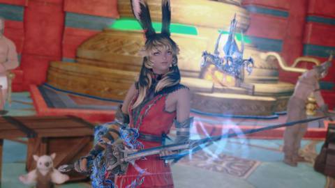 A Viera dressed in red holds up a glowing blue rapier in Final Fantasy 14