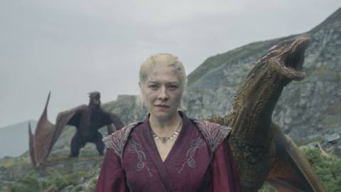 Rhaenyra (Emma D’Arcy) standing on Dragonstone with dragons behind her in a still from House of the Dragon season 2 episode 7