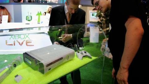 Visitors look at Microsoft’s latest game console the “XBOX 360” on August 17, 2005 in Leipzig, Germany. The convention is Germany’s largest fair for interactive entertainment, hardware and educational software. GETTY