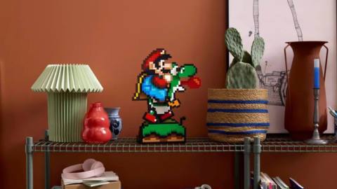 A stock image of the fully assembled Lego Super Mario World: Mario &amp; Yoshi set on a small shelf