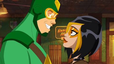 Dating supervillains (well, villains, anyway) Kite Man and Golden Glider smile at each other in a closeup in Max’s animated DC Comics-derived animated series Kite Man: Hell Yeah!