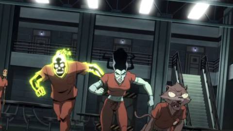 Doctor Phosphorus, Bride of Frankenstein, and Weasel, all wearing orange prison jumpsuits, rush at the screen as G.I. Robot, in a matching jumpsuit, stands curiously behind them in the first trailer for James Gunn’s Creature Commandos