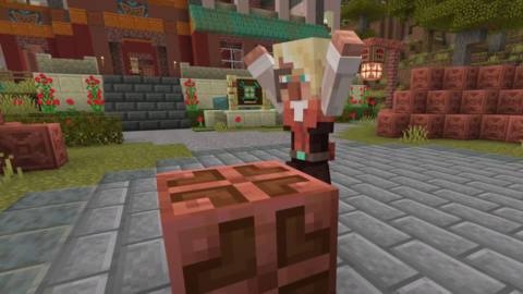 An image of a Minecraft character stretching its arms at a block table. 
