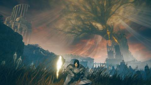 A female Tarnished wearing heavy armor sits at a Site of Grace in Gravesite Plain with the Scadutree in the background in a screenshot from Elden Ring: Shadow of the Erdtree