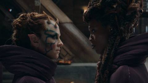 Mother Koril (Margarita Levieva) and Mother Aniseya (Jodie Turner-Smith) looking at each other up close