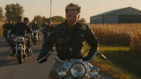 Austin Butler looks amazingly cool as he rides a motorbike one-handed, surrounded by his clubmates, in The Bikeriders