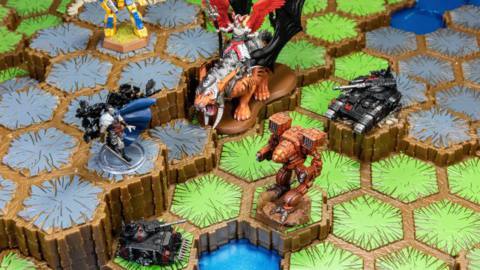 Several Heroscape tiles are shown in a close-up with figurines on various hexagon tiles.