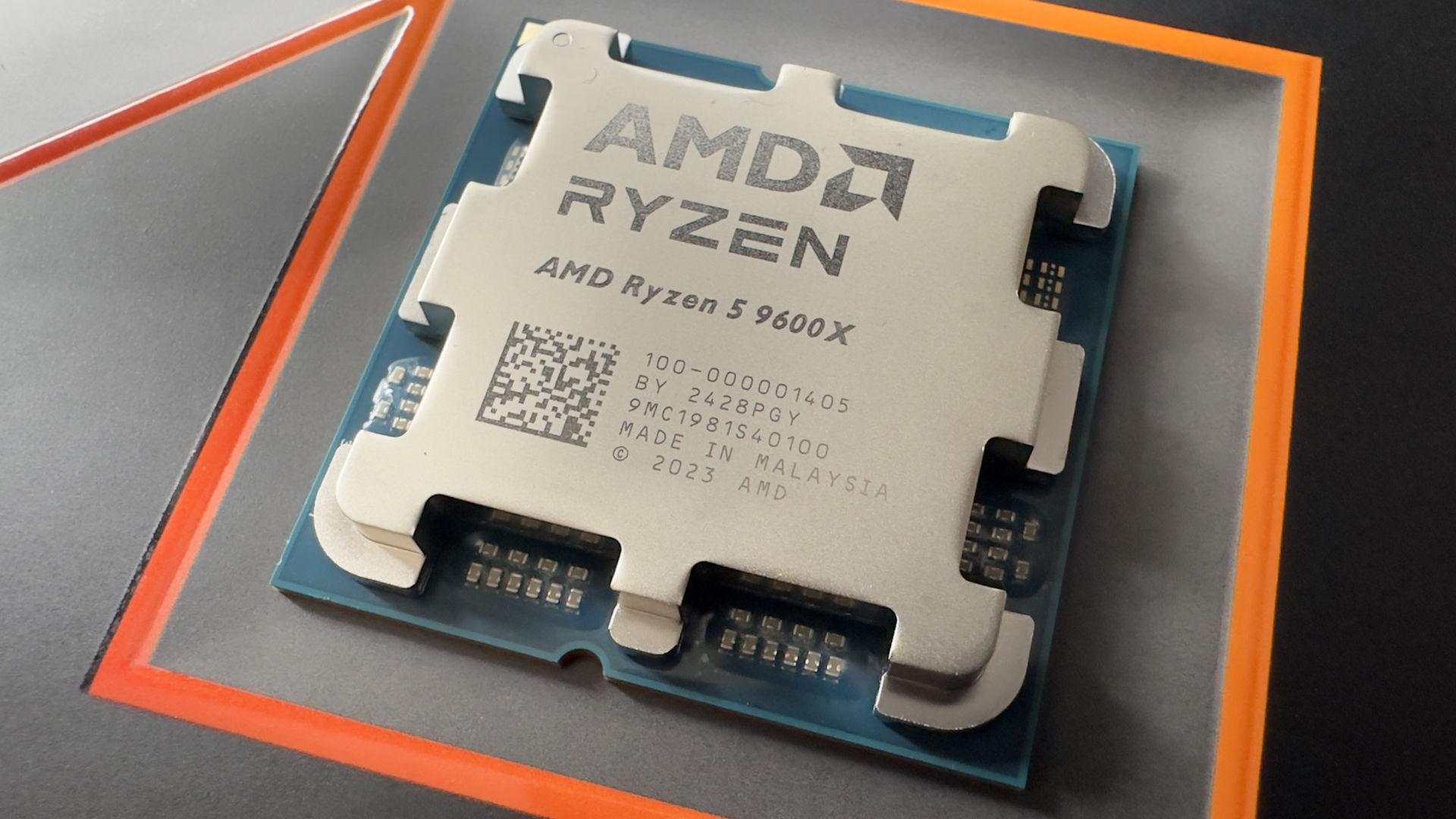 A close-up photo of an AMD Ryzen 5 9600X CPU