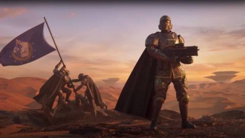 Key art from the Helldivers 2 Promotional video depicting a Helldiver standing proudly with a gun, with two others in the background hoisting a flag