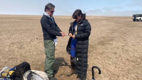 Michael Harvey and Ella Purnell on location in a desert for Fallout show