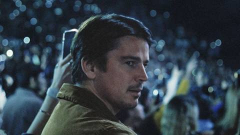 Cooper (Josh Hartnett) looking around a concert in a still from Trap