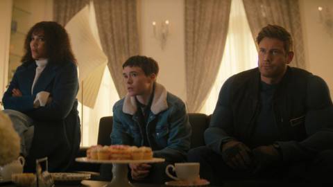 Allison, Viktor, and Luther sit on a couch looking generally disgruntled in Umbrella Academy