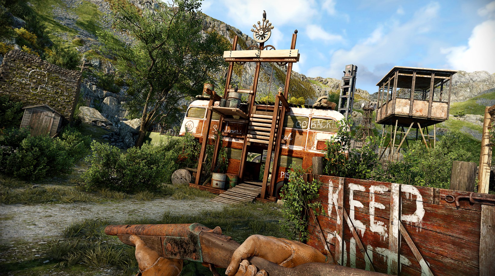 An Atomfall screenshot shows the player holding a gun and looking at a campsite with the words “keep out” written on it. An Atomfall screenshot shows the player holding a gun and looking at a campsite with the words “keep out” written on it.