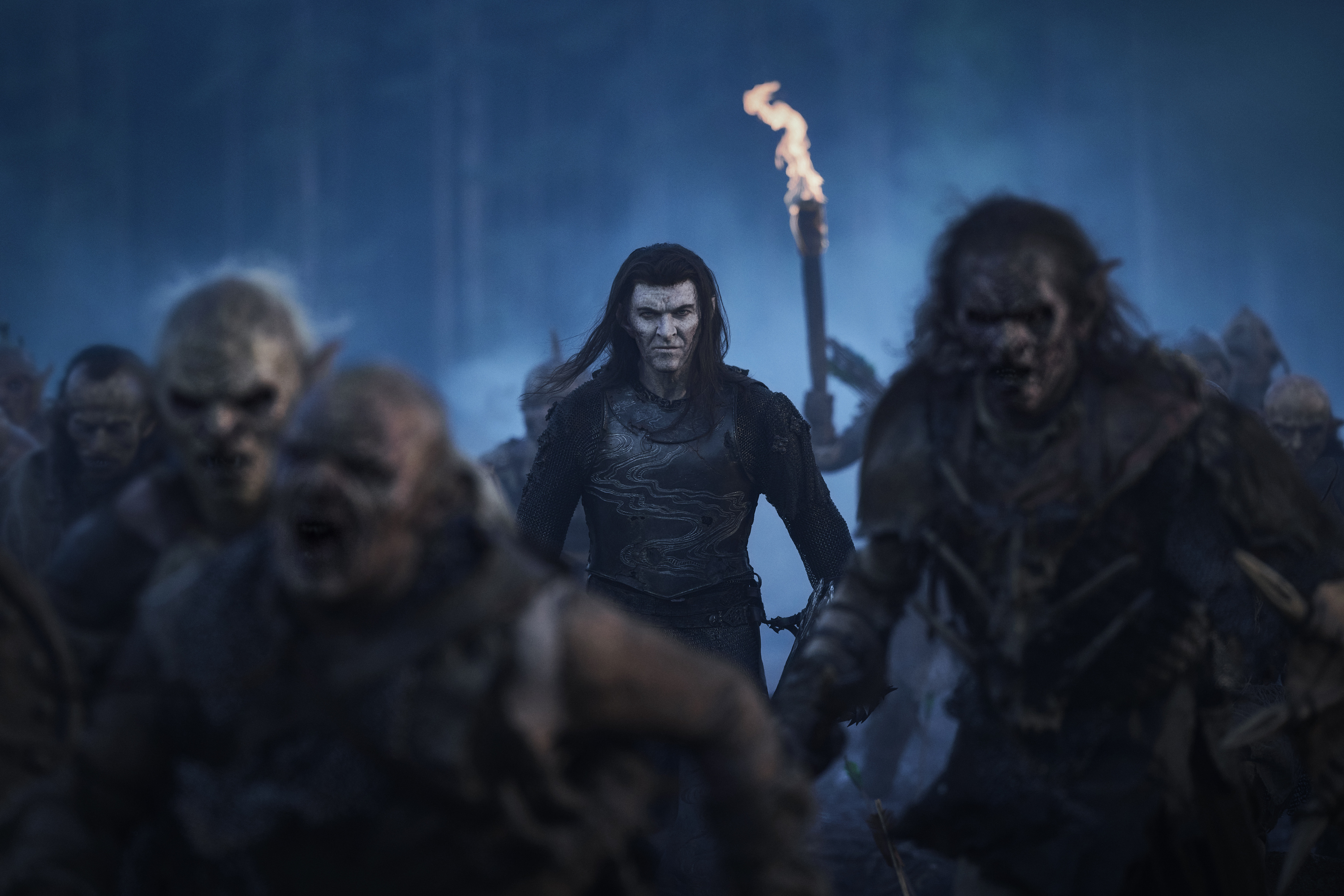 Adar walking among orcs headed off to battle