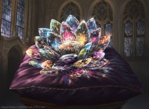 A flower made of rainbow gems sits on a purple velvet cushion inside a cathedral.