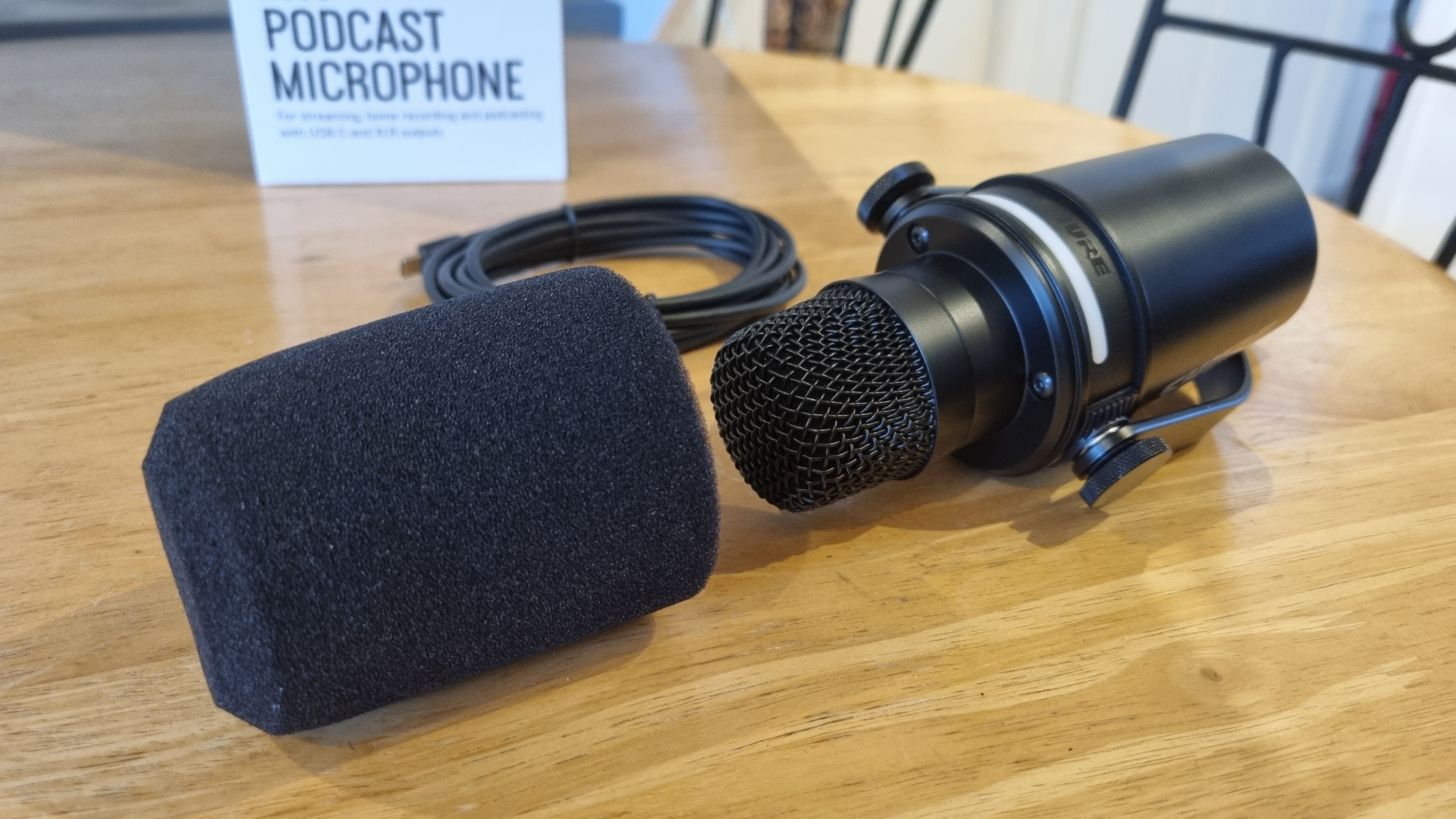 The Shure MV7+ Podcast Microphone with the foam shield removed, showing the microphone within