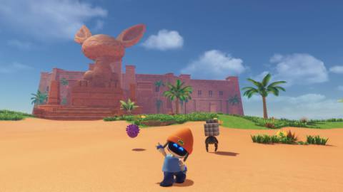 Astro Bot, dressed as PaRappa the Rapper, waves at the camera in a desert setting. Behind him are two strange characters: a floating purple head and a robot with a metal cube for a head