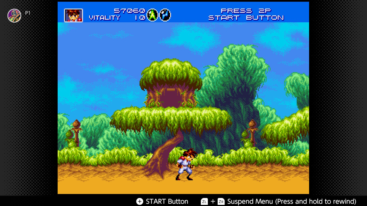 The hero runs through the environment and under a treehouse in Gunstar Heroes The hero runs through the environment and under a treehouse in Gunstar Heroes