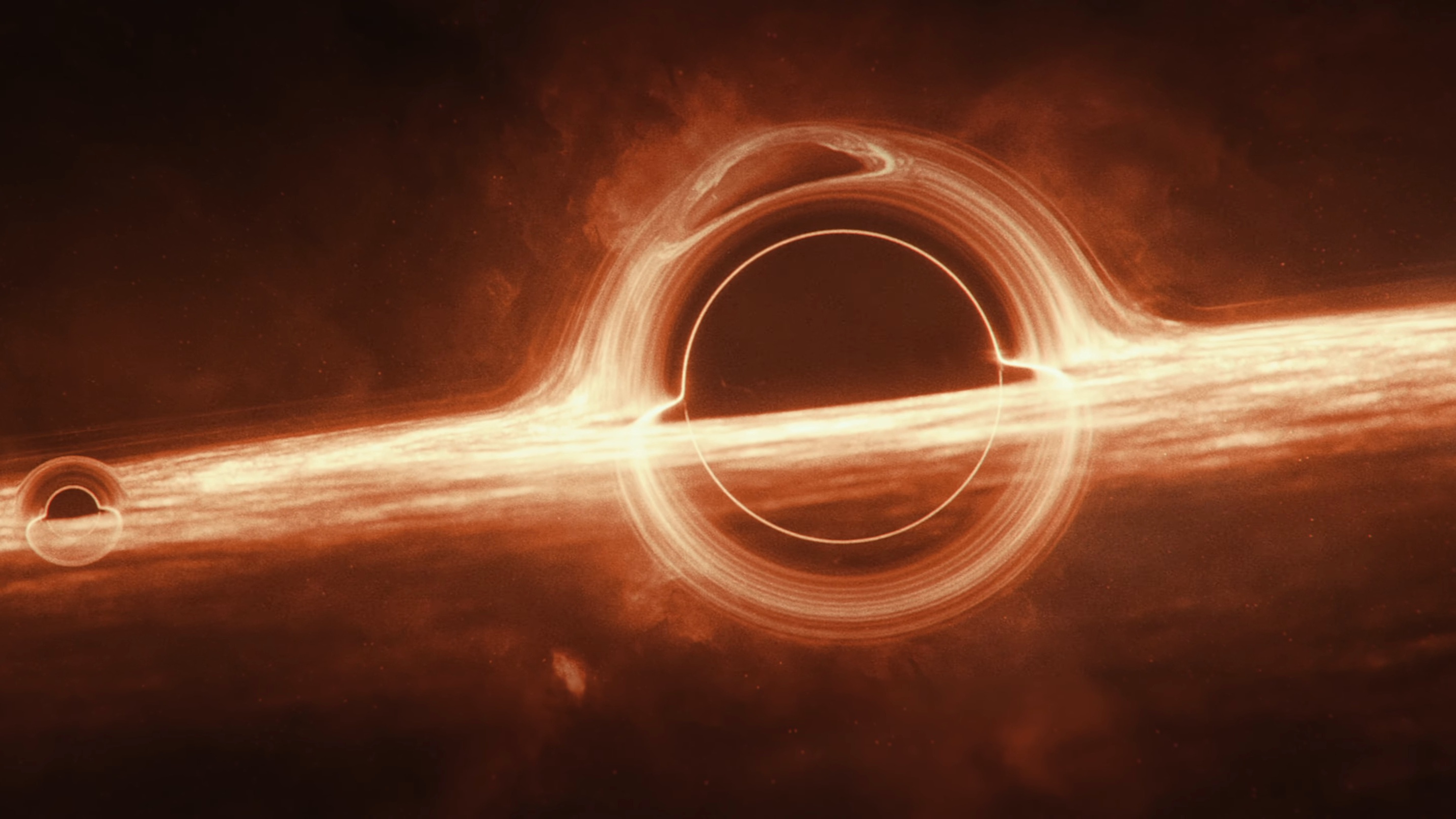 A black hole hangs ominously in space.