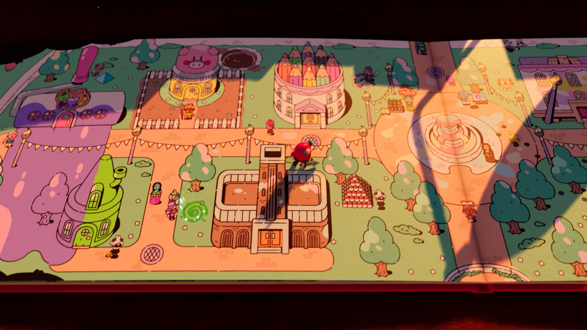 Jot, a 3D cute knight character, stands on the pages of his own book, showing an illustration of a bustling town. Afternoon light casts shadows across the book.