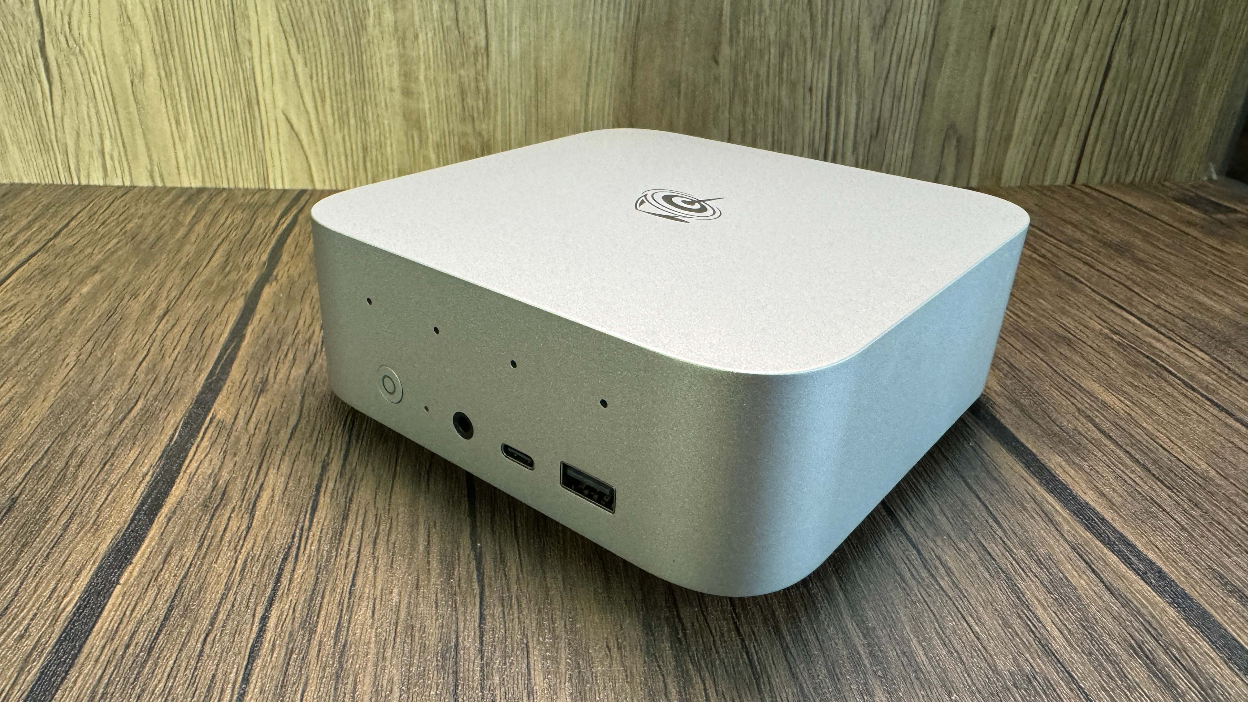 Beelink SER9 Mini PC on a wood background