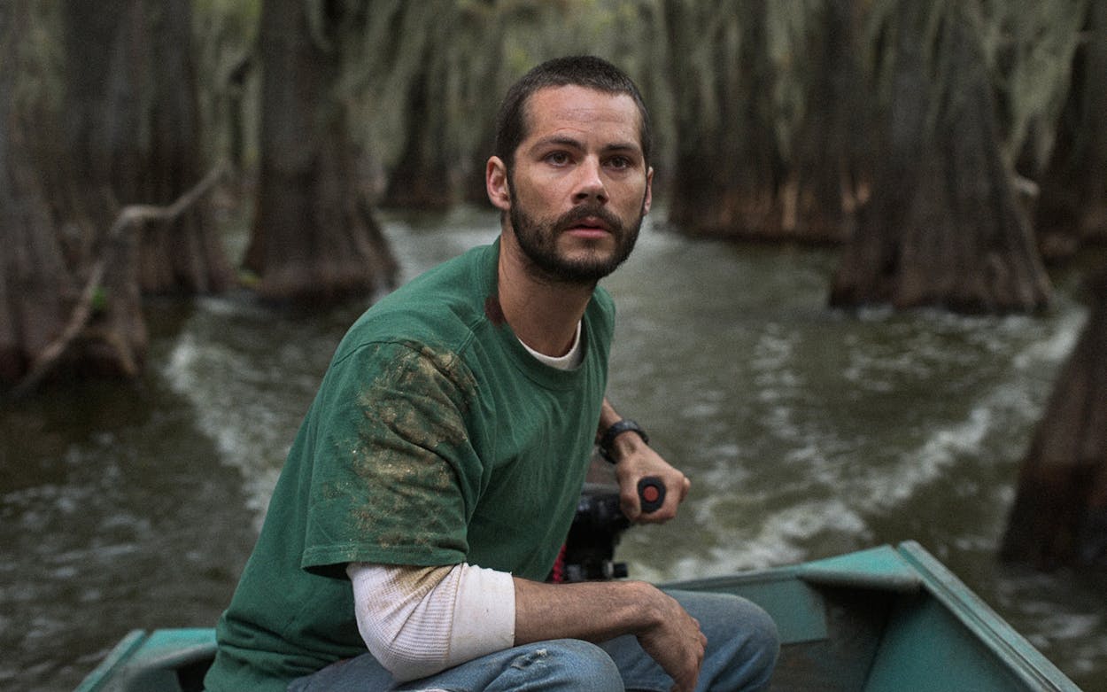 Dylan O’Brien piloting a motorboat in Caddo Lake.