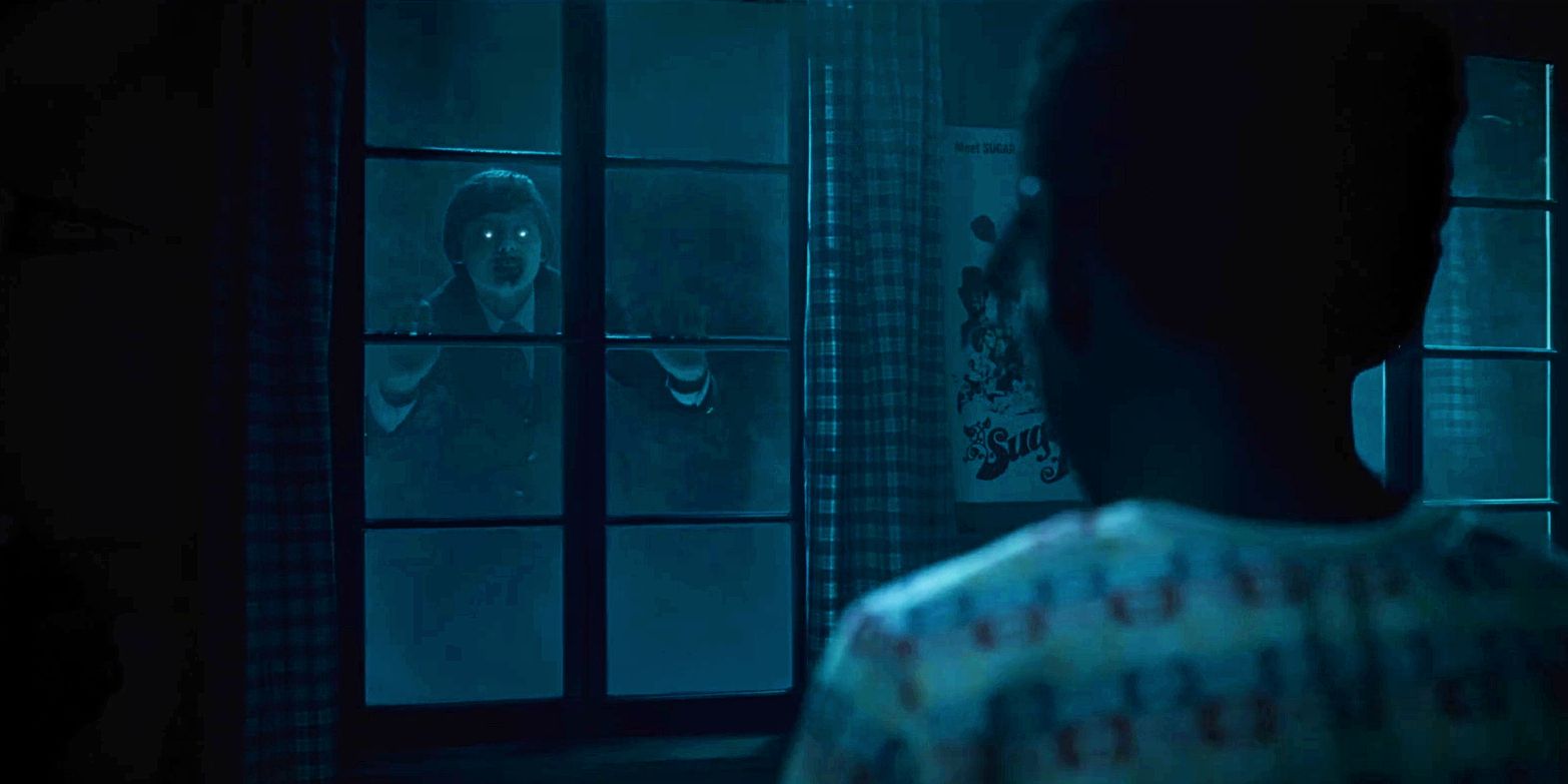 A ghoulish child-like creature floating outside a window with a young child staring in Salem’s Lot (2024).