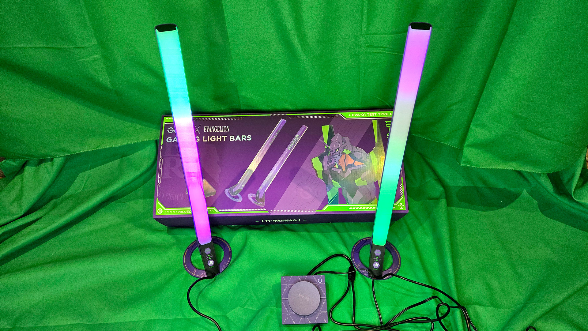 The Govee x Evangelion lighting kits set up on a wall and around a desk and drum kit with various RGB lighting modes enabled.