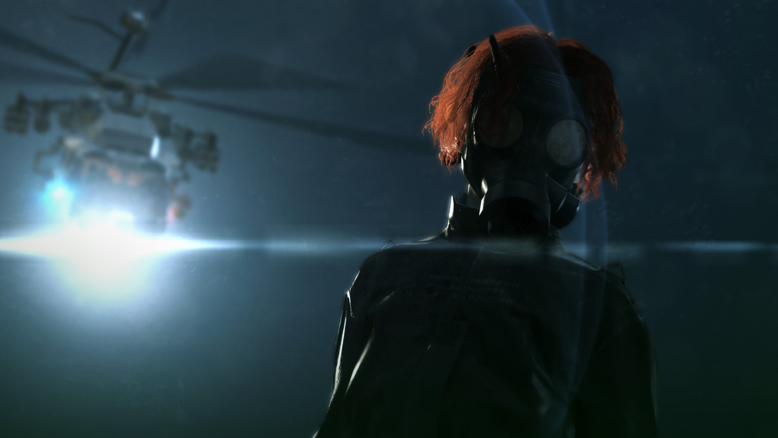 A red-haired child wearing a black straight jacket and gas mask staring downward with a helicopter in the background in Metal Gear Solid 5: The Phantom Pain.