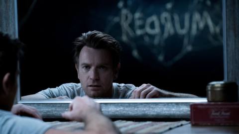 Adult Danny Torrance looks in a mirror to see the word “redrum” in Doctor Sleep