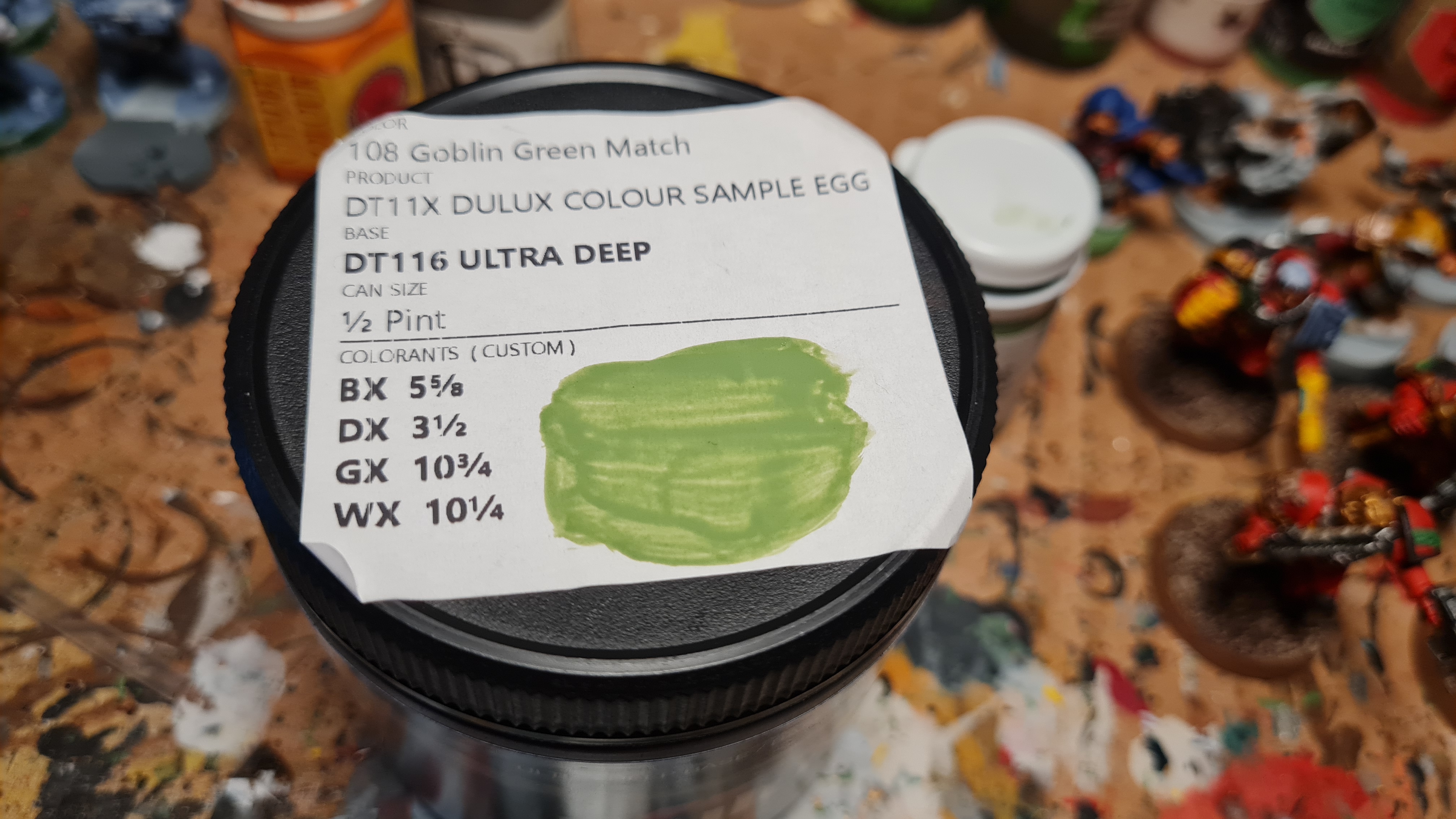 A breakdown of the colours used by Dulux to colour-match Coat d'Arms Goblin Green. Top to bottom list: Black BX, green DX, yellow DX, and white WX pigments used.