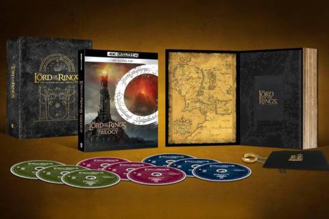 An image showing the contents of the new Lord of the Rings - One Ring box set, which include the 9-disc set of films on 4K Blu-ray, plus a hardcover book that serves as a case for the One Ring replica from Noble Collection.