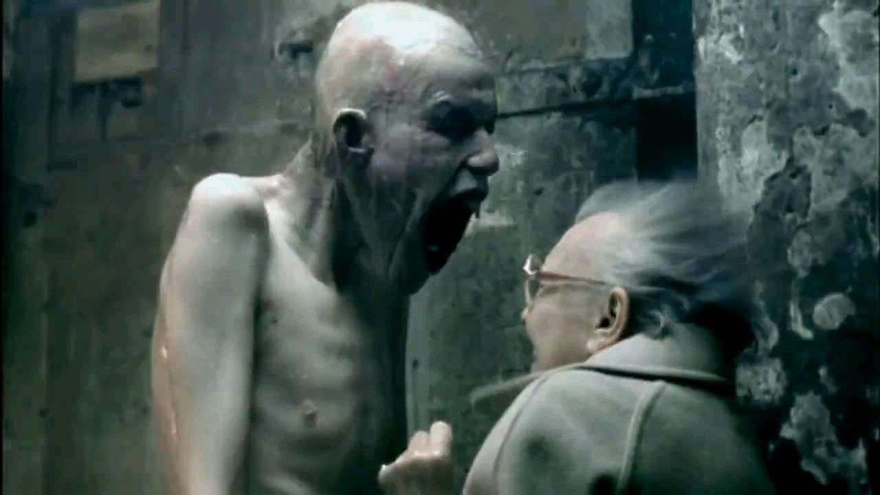 A tall, emaciated man screaming in the face of a woman in the music video for Aphex Twin’s Come to Daddy.