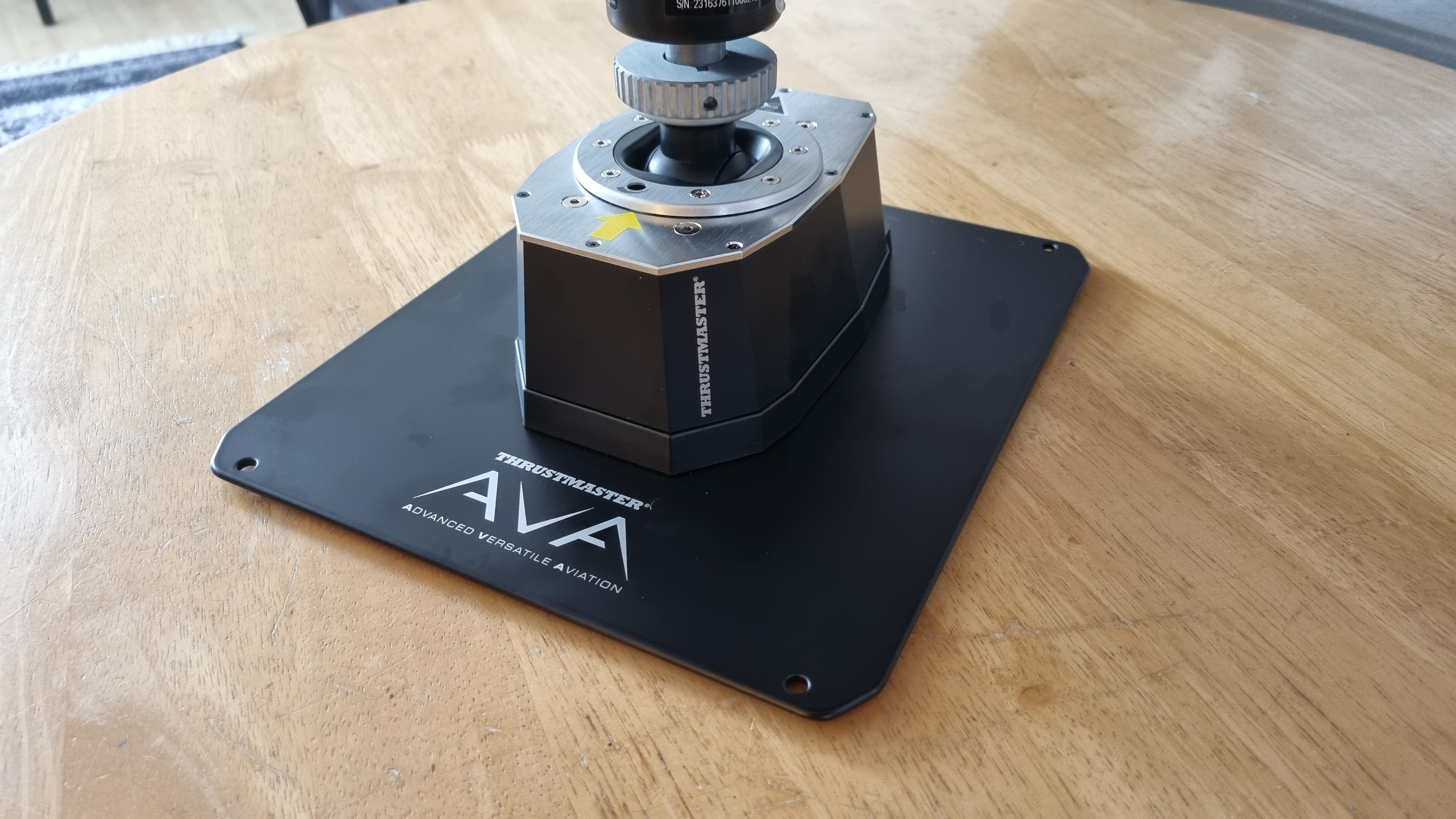 The baseplate and Thrustmaster AVA base unit on a table