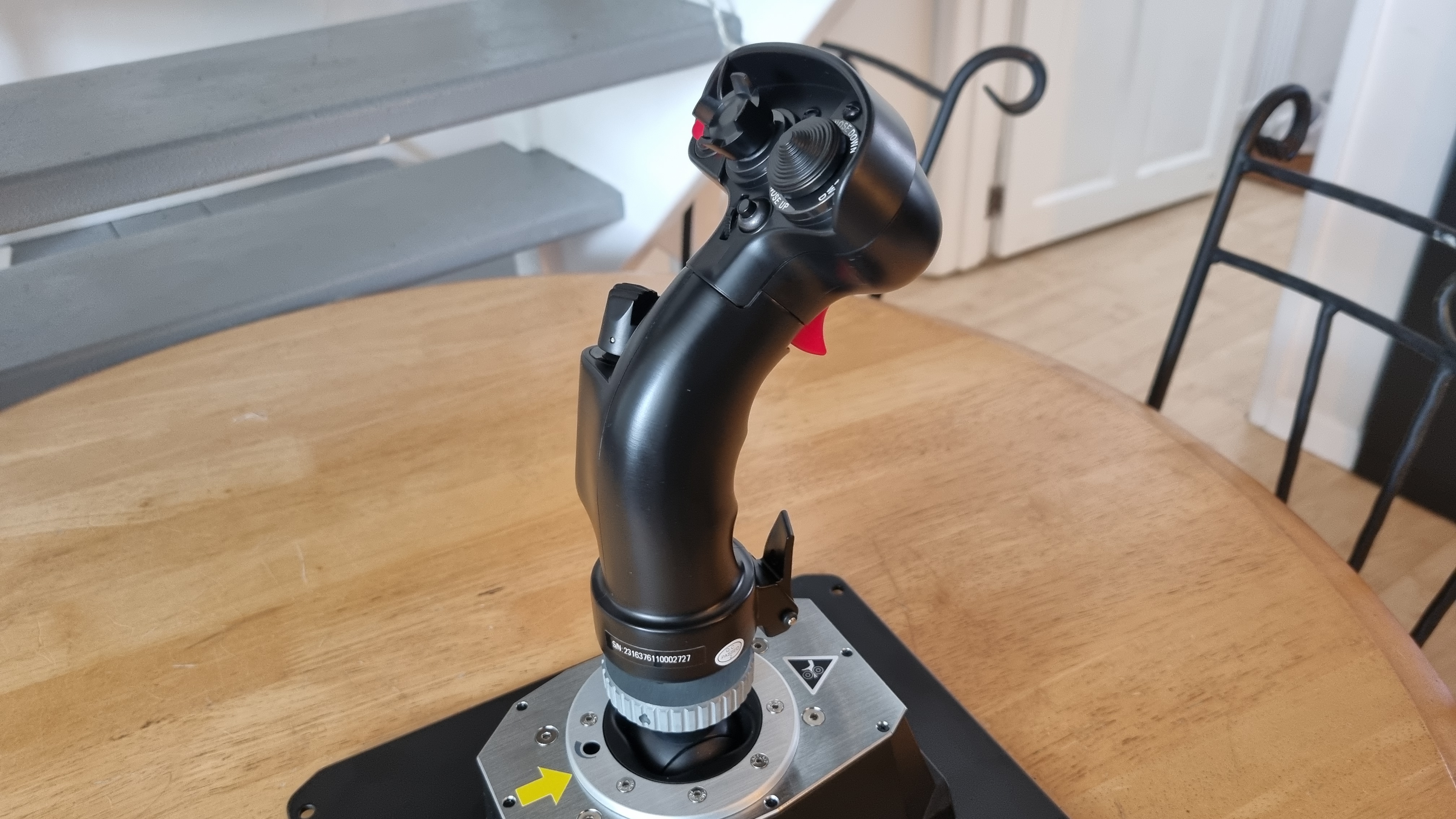 The Thrustmaster AVA F/A-18 Super Hornet Flight Stick in profile on a table