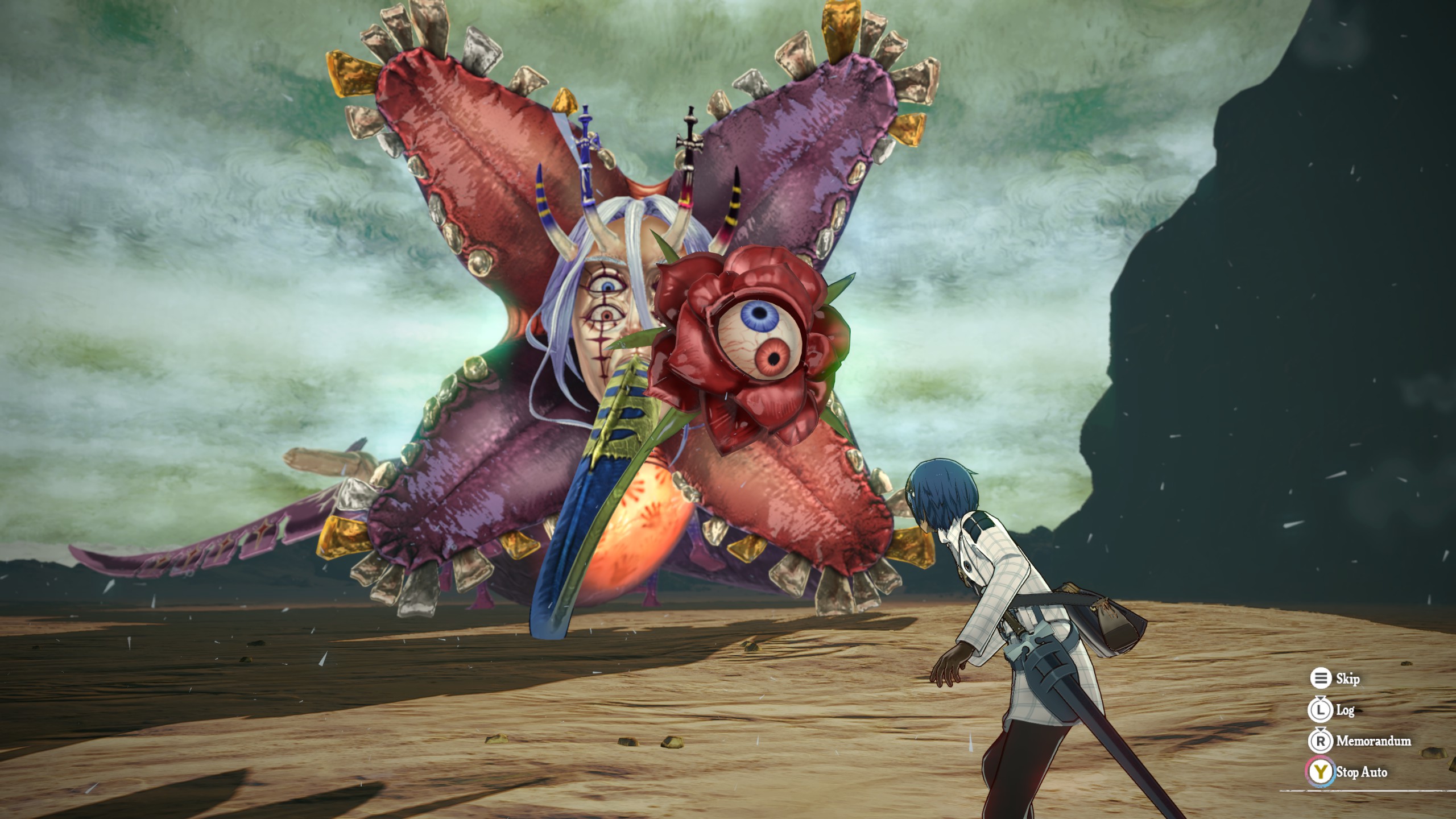 A huge monster looms above the protagonist in the desert. It looks like a multicolored flower surrounding a horrible human face with extra eyeballs, and a protruding eyeball on a tongue. 