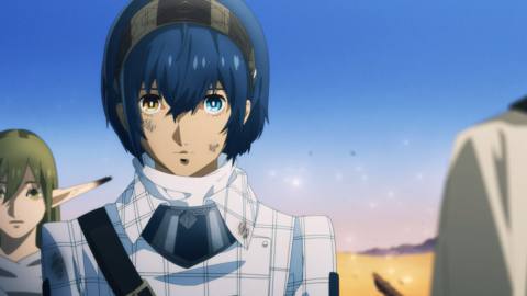 The protagonist of Metaphor: ReFantazio is a young man with blue hair and a plaid coat. He walks across a desert with a dirty face and a tired expression