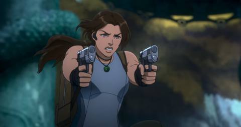 Lara Croft with her dual pistols firing at an off-screen bear in Tomb Raider animated series