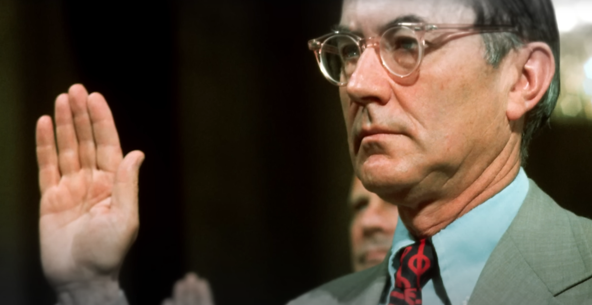 A picture of former CIA Director William Collby testifying before congress