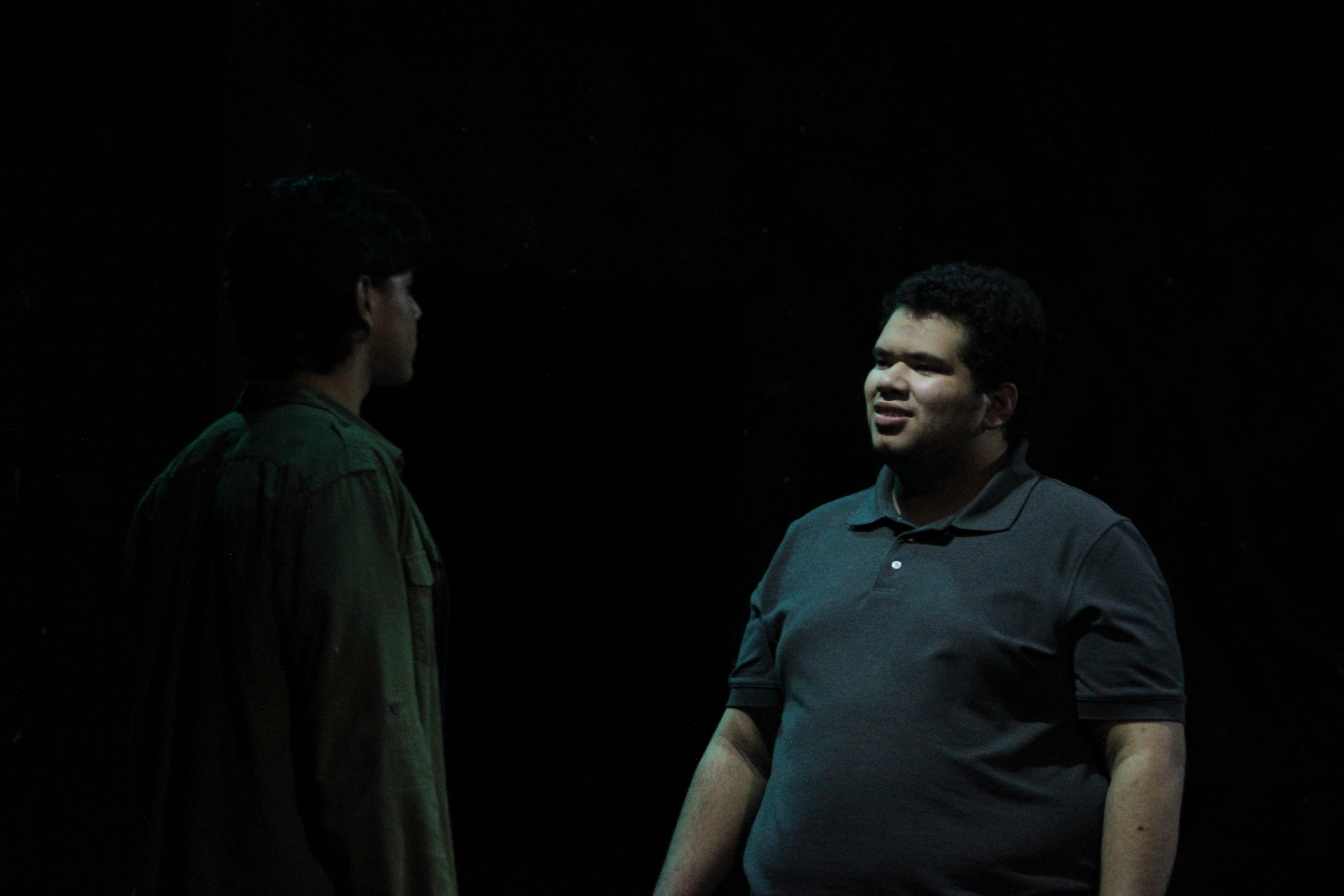 Two men having a conversation in pitch dark environment in Silent Hill 2 stage adaptation Our Special Place