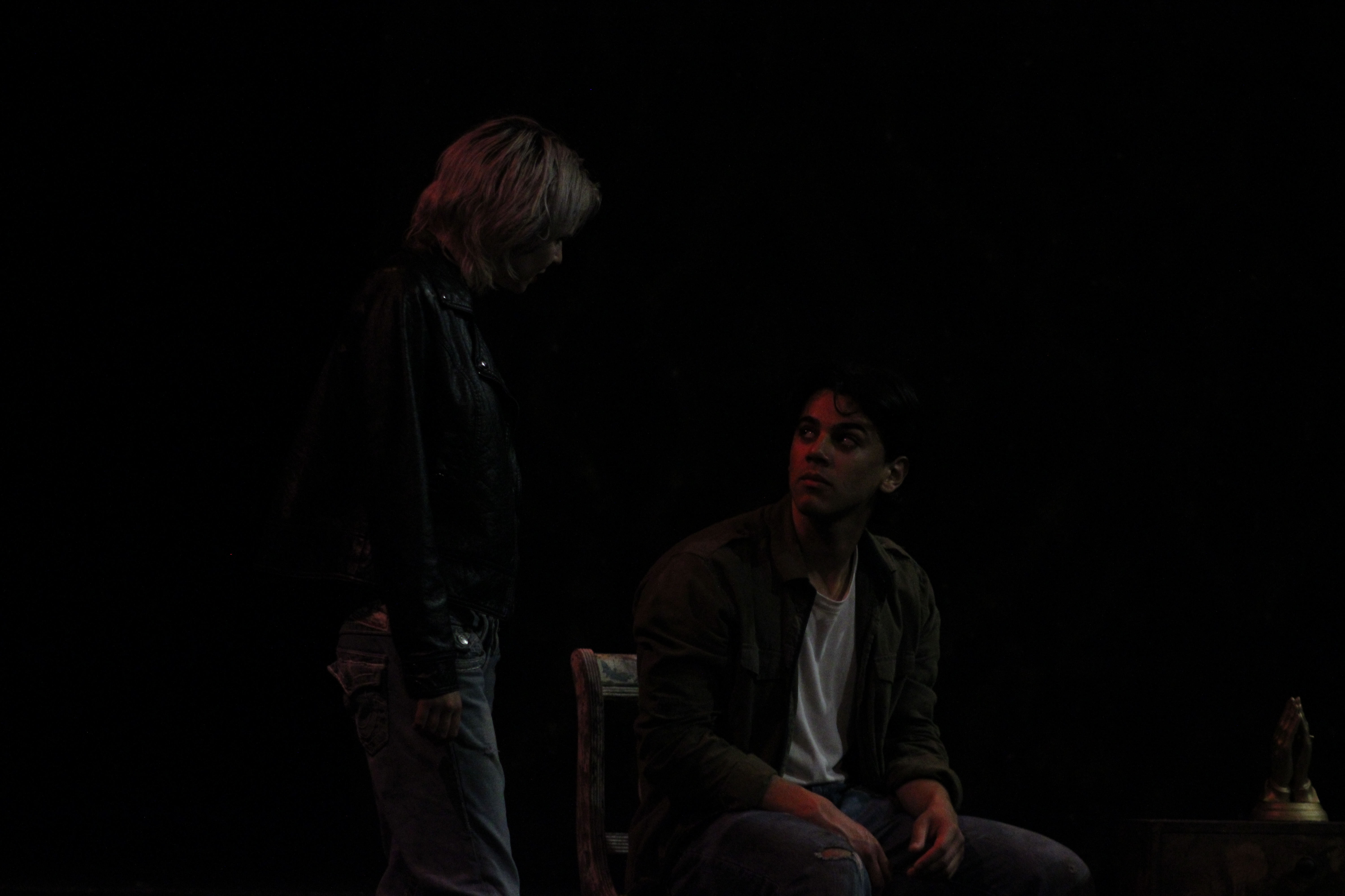 Standing figure in conversation with seated man in Silent Hill 2 stage adaptation Our Special Place