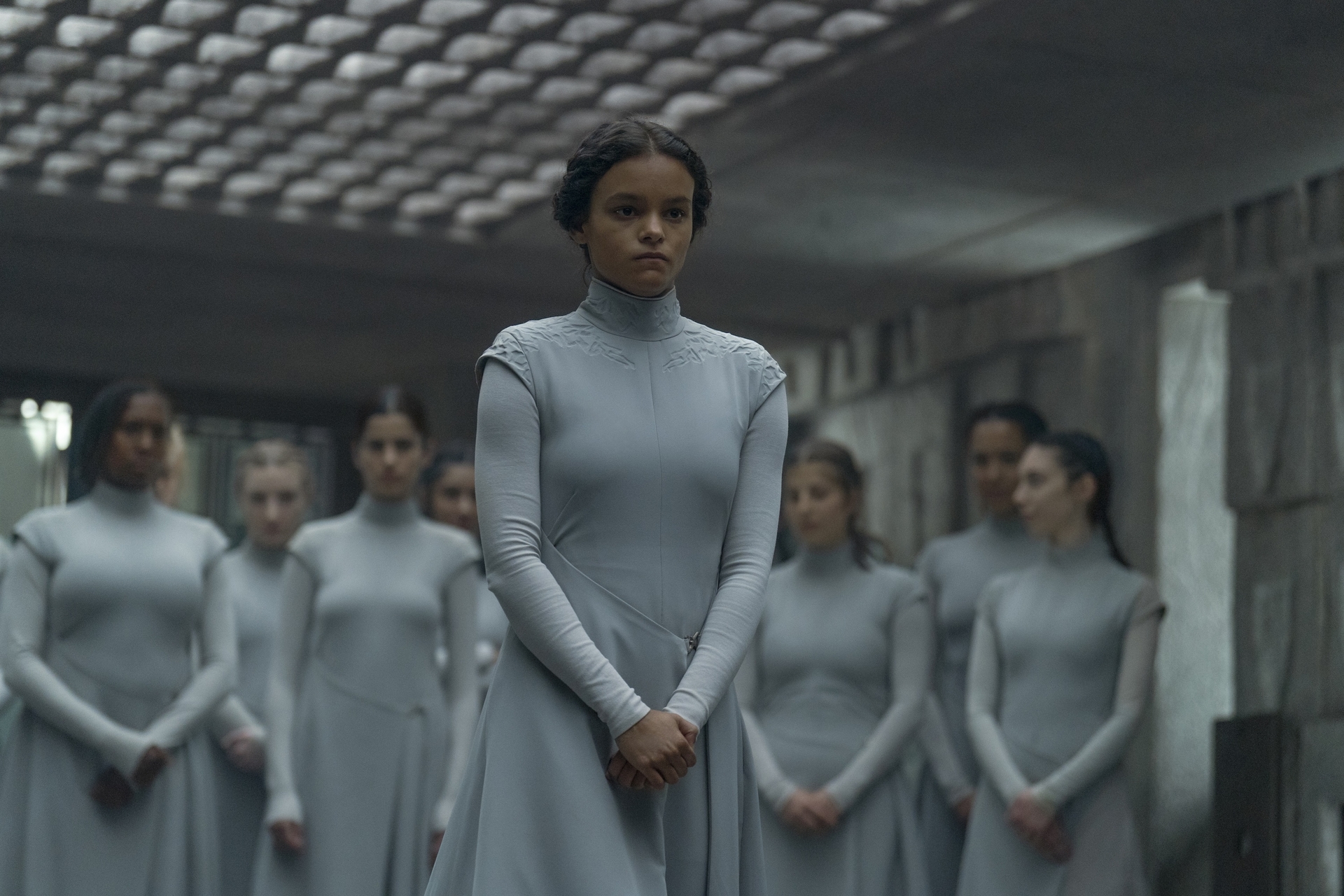 Sister Lila (Chloe Lea) standing in front of her fellow Bene Gesserit trainees in a still from Dune Prophecy